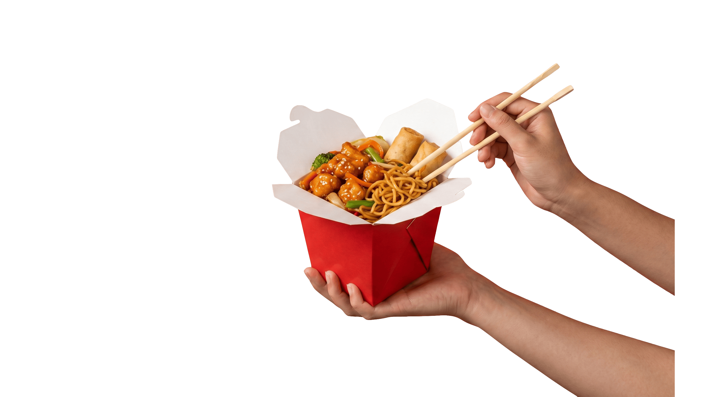 A hand holding a takeout box of General Tso's chicken, lo mein and spring rolls, chopsticks lifting a bite